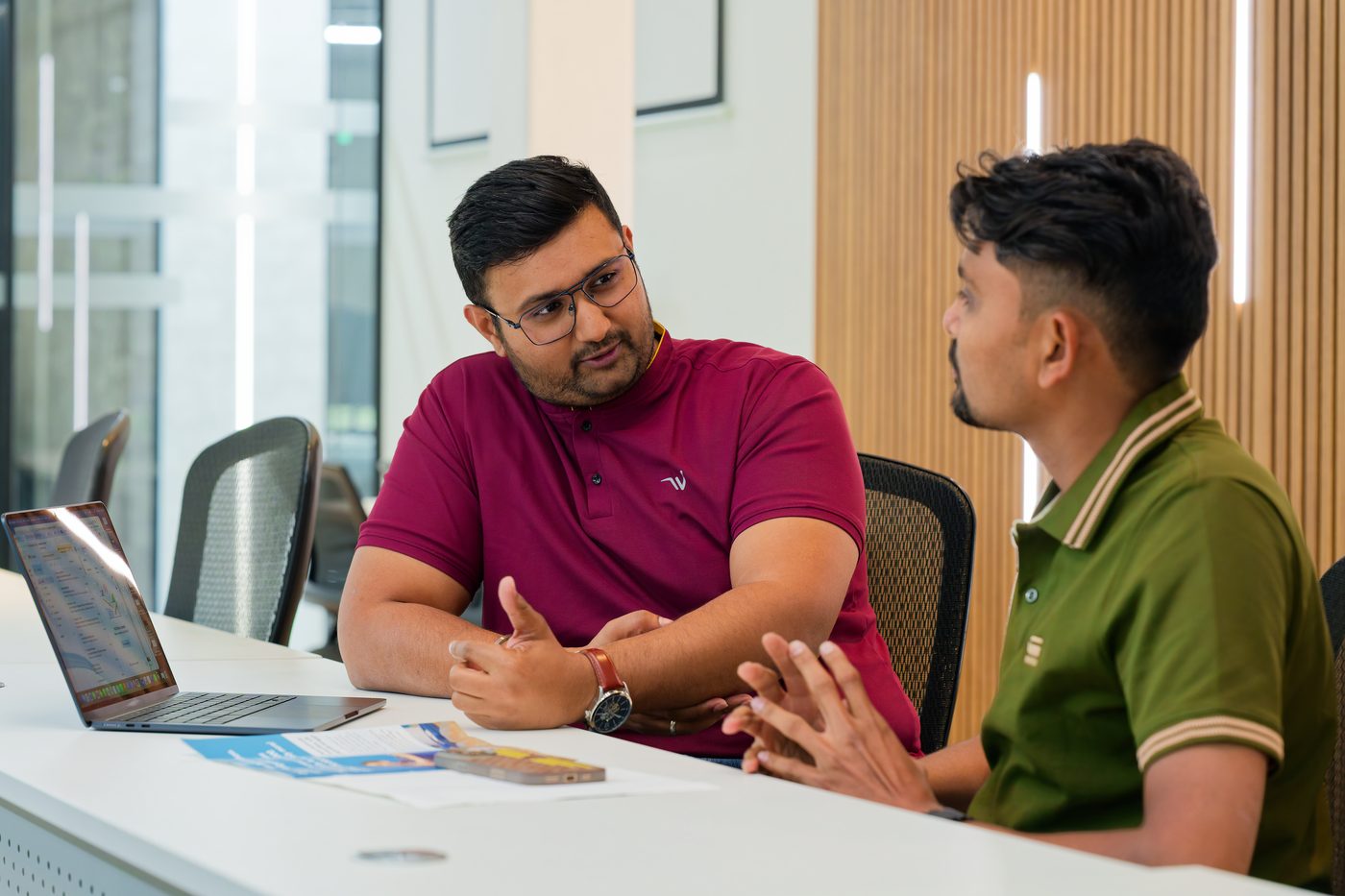 Two NexAura founders planning a client's content month